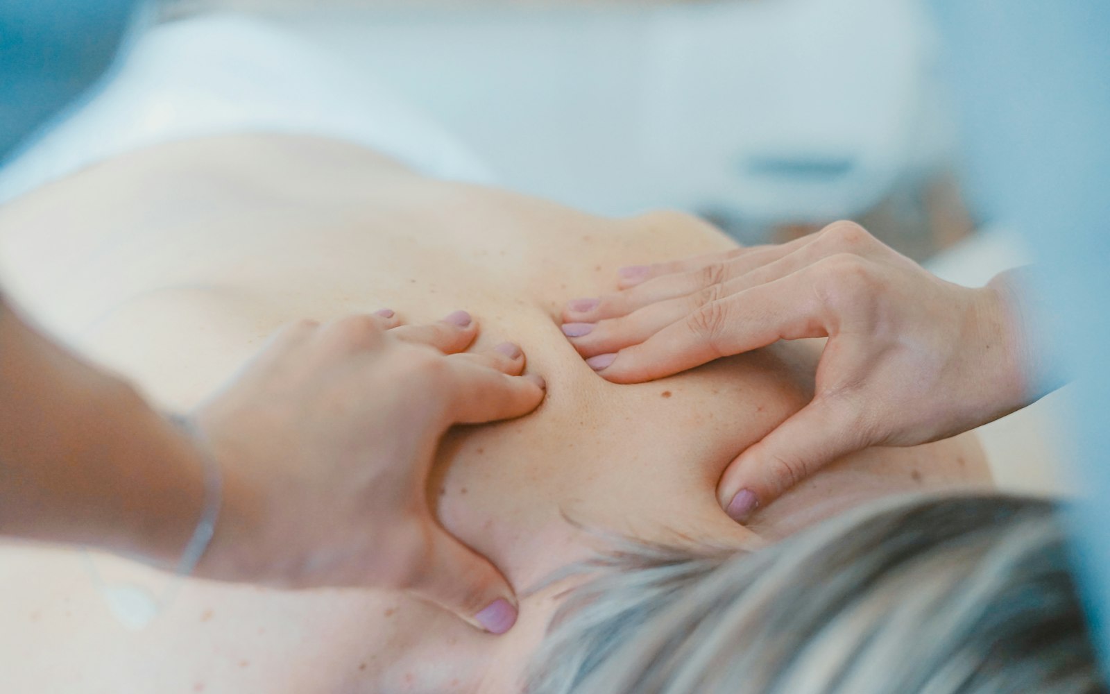Deep sports massage of an athlete's muscles during a recovery session.
